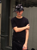 Plumed caphead