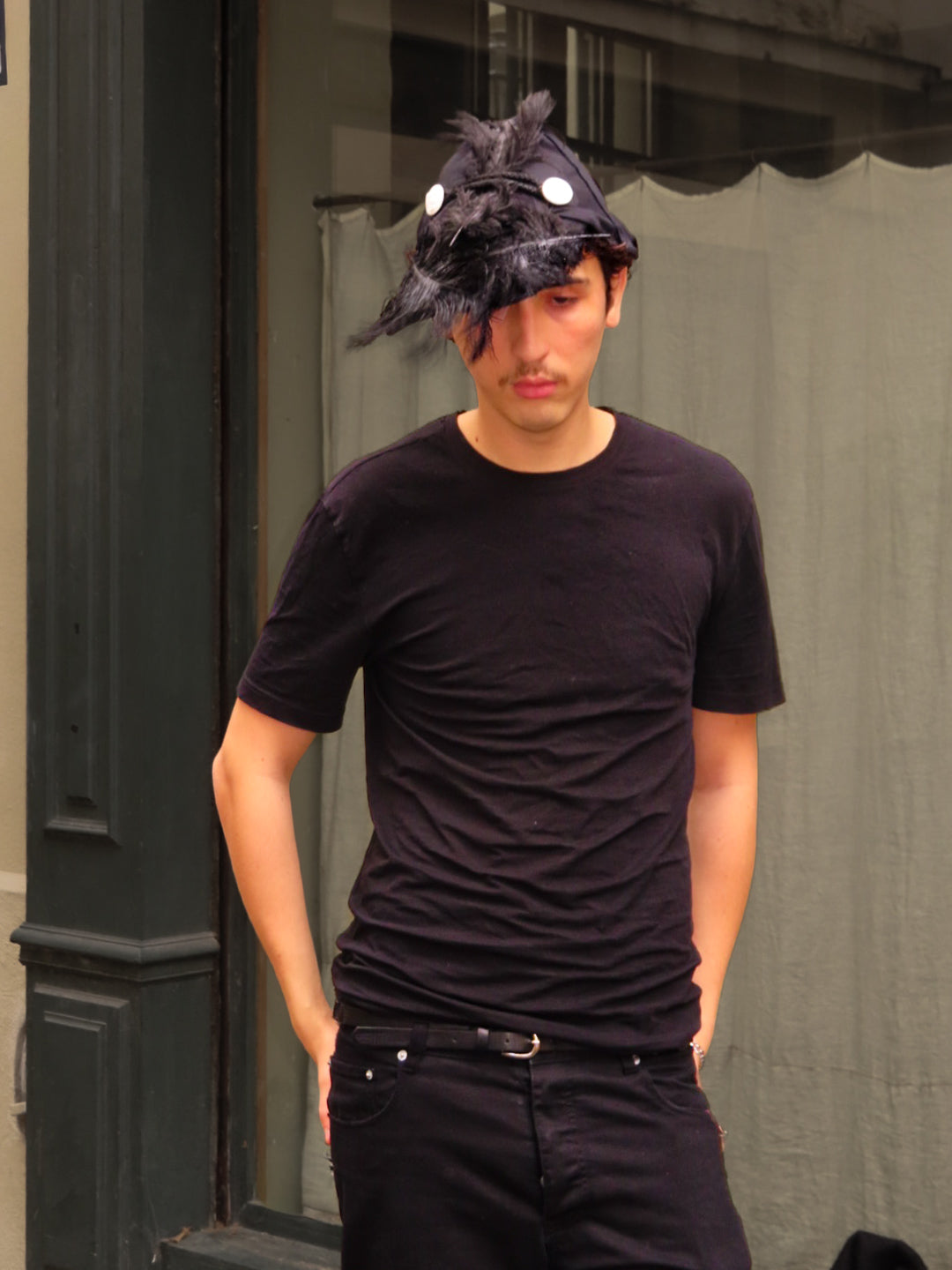 Plumed caphead